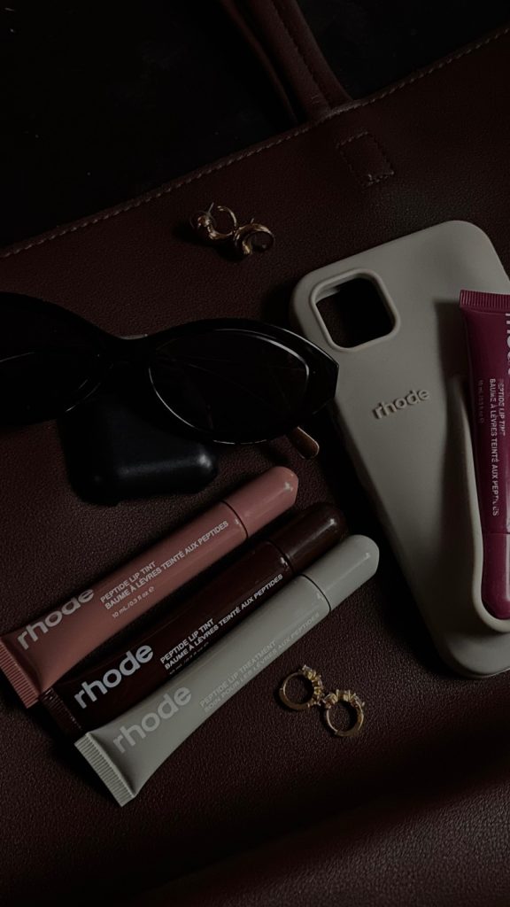 makeup and a phone case on a desk