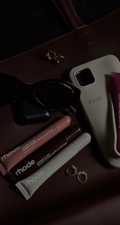 makeup and a phone case on a desk